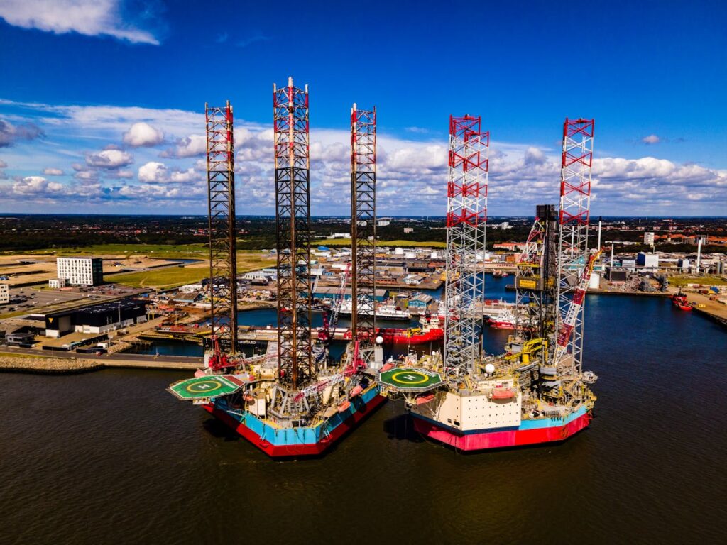 Aerial Panorama of Oil Rigs with Helipads Moored at a Port Terminal